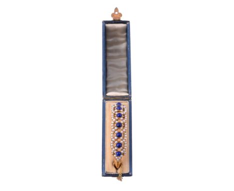 A Victorian lapis lazuli and half pearl bangle, circa XXXX  A Victorian lapis lazuli and half pearl bangle,   circa XXXX, the