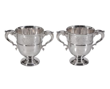 A pair of mid 18th century Irish silver twin handled cups by Michael Byrne  A pair of mid 18th century Irish silver twin hand