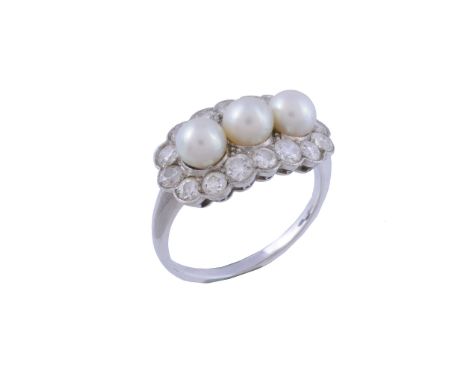 A pearl and diamond ring, the three pearls within a surround of brilliant... A pearl and diamond ring, the three pearls withi