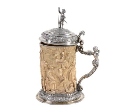 A German silver parcel gilt mounted ivory Historismus tankard, pseudo marks  A German silver parcel gilt mounted ivory Histor