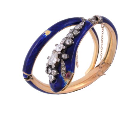A mid Victorian diamond and blue enamel snake bangle, circa 1860, the serpent  A mid Victorian diamond and blue enamel snake 