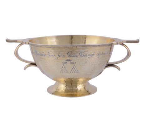 [Theatre interest] An Edwardian hammered silver gilt twin handled pedestal...  [Theatre interest] An Edwardian hammered silve