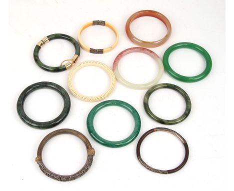 A jade type bangle; together with other bangles.Condition Reportgood overall condition