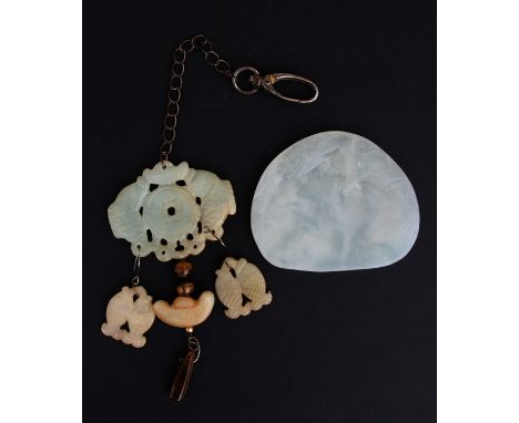 A Chinese jade / hardstone paint block decorated with a dragon; together with a jade / hardstone pendant (2).