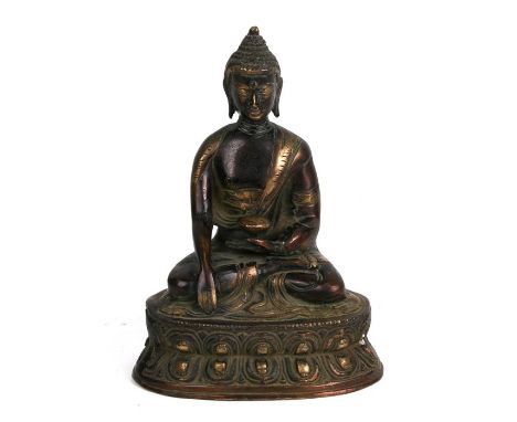 A Chinese bronze Buddha seated in meditation, 20cms (8ins) high.