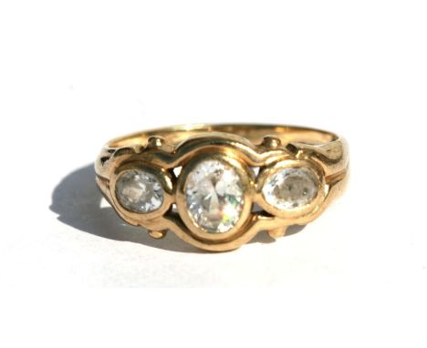 A 9ct gold three-stone dress ring, approx UK size 'J'.