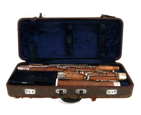 A Bassoon with silver plated mounts and keys, cased.