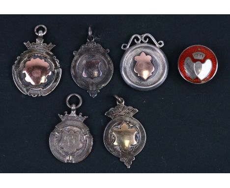 Five silver fob medallions and a guilloche and enamel silver lapel badge, various makers and dates, total weight 38.4g.