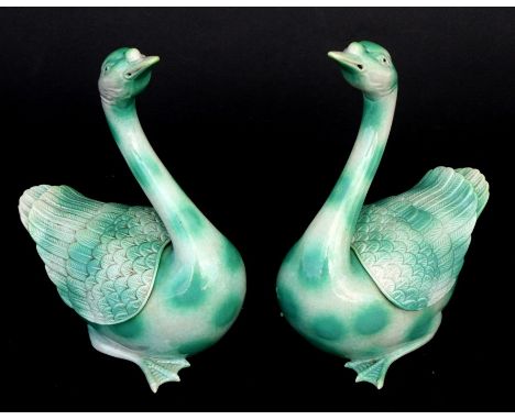 A pair of pottery  mottled green glazed Chinese censers in the form of geese, impressed seal mark to the underside, 21cms (8.