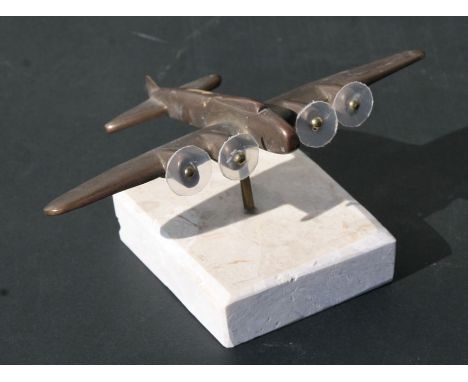 A bronze model of the WW2 heavy bomber the Boeing B-17 Flying Fortress mounted on a marble base. Wingspan 13.5cms (5.25ins)