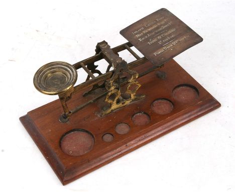 A Morden &amp; Co. brass postal scales (lacking weights); together with a hand magnifier (2).