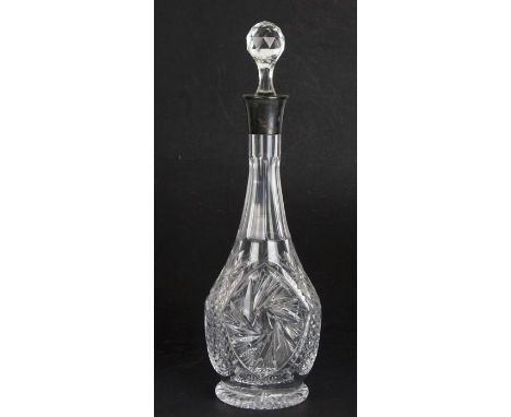A silver mounted cut glass decanter, 38cms (15ins) high.