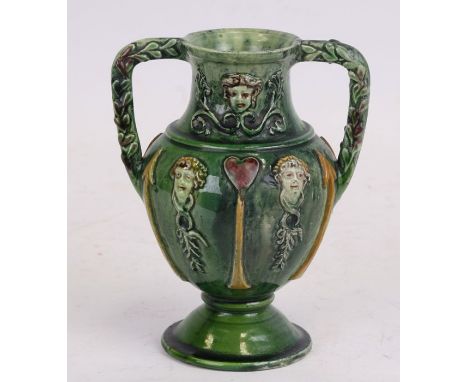 A Castle Hedingham two-handled vase by Edward Bingham, decorated with figures and Tudor motif, pottery mark to base, 17cms (6