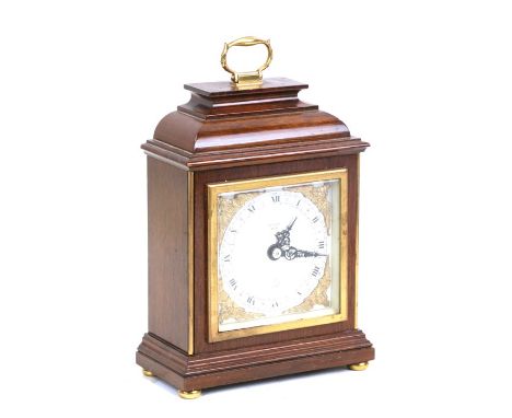 An Elliott mahogany cased mantle clock with silvered dial and Roman numerals, retailed by Mallory of Bath. 22cm ( 8.75 ins) h