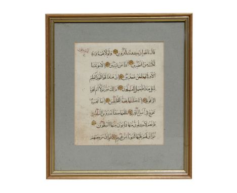 An early Persian manuscript page from the Koran with gilt highlights, framed &amp; glazed, 19 by 22cms (7.5 by 8.75ins).