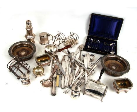 A quantity of silver plated items to include a pair of wine coasters, mustard pot, sugar caster, toast racks and flatware.