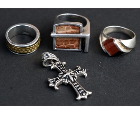 A quantity of silver jewellery to include a tiger's eye ring, two other rings and a cross (4).Condition Report40g.