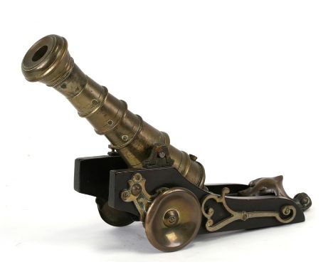 A Cope &amp; Collinson Patent bronze cannon on carriage, 38cms (15ins) long.