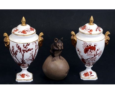 A pair of Coalport Indian Tree Coral pattern two-handled lidded pedestal urns, 17.5cm (7 ins) high) together with a Poole Pot