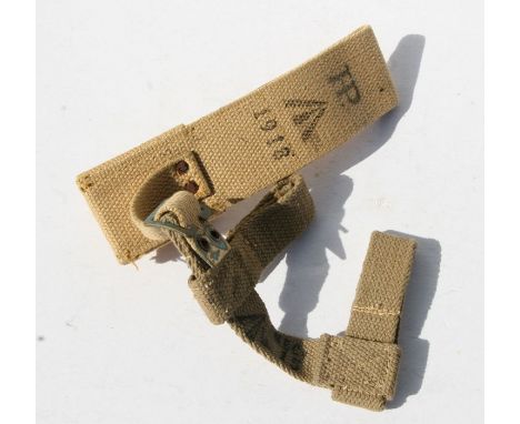 An 08 Pattern bayonet frog with helve strap and carrier. Marked to the reverse of the frog with the War Department arrow and 