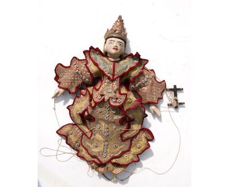 An early 20th century Burmese puppet with brocade clothing, 65cms (25.5ins) high.