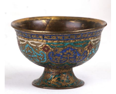 A Persian gilt brass and enamel pedestal footed bowl, 8cms (3.25ins) diameter.