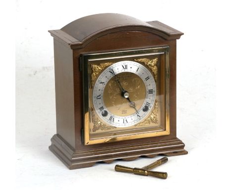 An Elliott of London mahogany cased mantle clock with silvered dial and Roman numerals, the movement striking on a bell,  ret