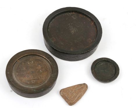 An early Ecclesiastical lead wool weight, initialled 'ITS', 5cms (2ins) high; together with three various circular bronze wei