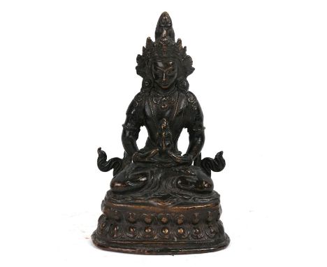 A Chinese bronze Buddha seated in meditation. 17cms (6.75ins) high.