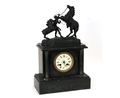 A Victorian black slate mantle clock surmounted with a spelter group depicting a rearing horse, 45cms (17.5ins) high.Conditio