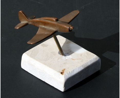 A small bronze WW2 fighter aircraft mounted on a marble base. Wingspan 7.5cms (3ins)