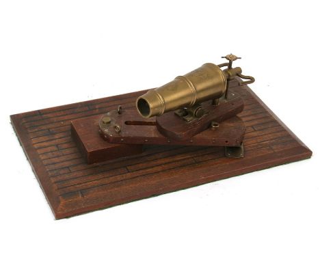 A bronze model of a cannon W. North. 1848, mounted on a wooden pivoting stand, overall 37cms (14.5ins) long.