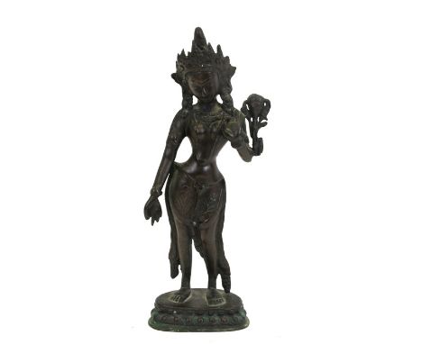 A bronze figure in the form of an Indian deity, 30cms (12ins) high.