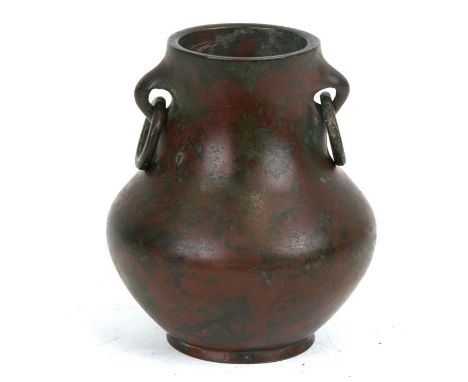 A Chinese bronze vase with ring handles, 10cms (4ins) high.