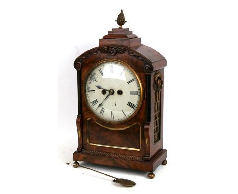 An early 19th century bracket clock, the 20cm (8ins) painted dial with Roman numerals, fitted with an 8-day movement striking