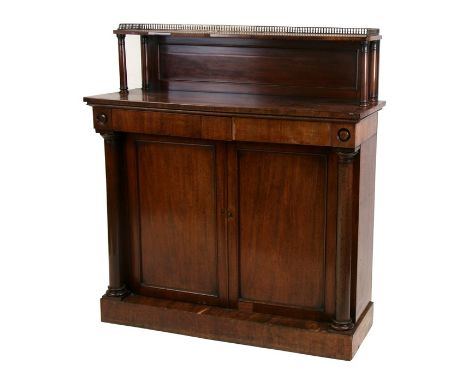 A Regency mahogany chiffonier, the single shelf superstructure with three quarter brass gallery above two frieze drawers with