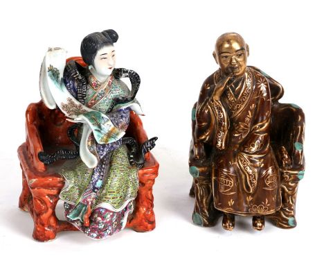 A Chinese famille rose figure depicting a robed lady holding a scroll seated on a chair, 17cms (6.75ins) high; together with 