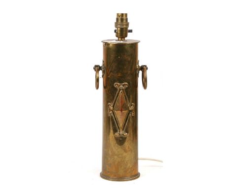 A trench art table lamp formed from a shell, 30cms (12ins) high.