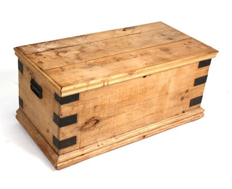 An iron bound pine trunk, 85cms (33.5ins) wide.