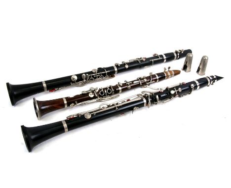 A rosewood clarinet; together with two other similar (3).