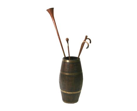 A coopered oak stick barrel, 62.5 cms (24.5ins) high; together with a copper hunting horn and four walking sticks (6).