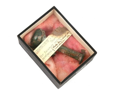 A Roman glass Lachrymatory or tear bottle for funerary unguents or perfumes, 9cms (3.5ins) high; together with a bronze stylu