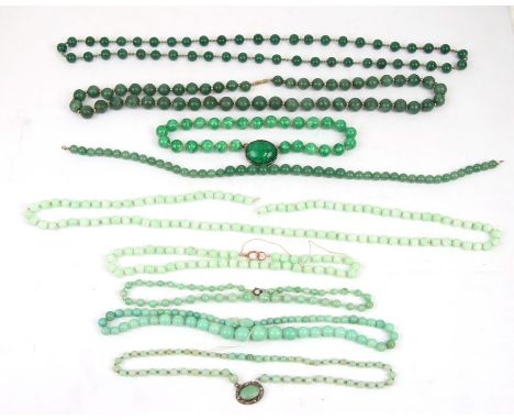A jade like necklace and other similar necklaces.