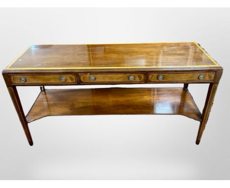 A reproduction mahogany and burr walnut side table fitted with three drawers, width 137 cm x 46 cm deep x 71 cm high 