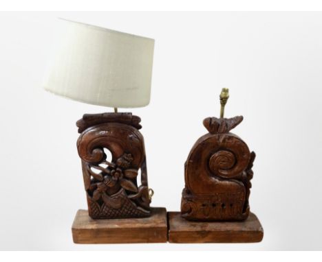Two Eastern heavily carved table lamps, one with shade, tallest 75 cm high overall 