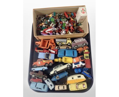 A group of vintage diecast metal vehicles including Dinky, Corgi, etc, and a quantity of plastic figures.