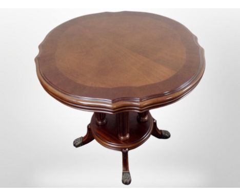 A reproduction mahogany coffee table, diameter 60 cm  