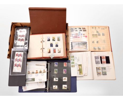 A box of stamp albums and first day covers 