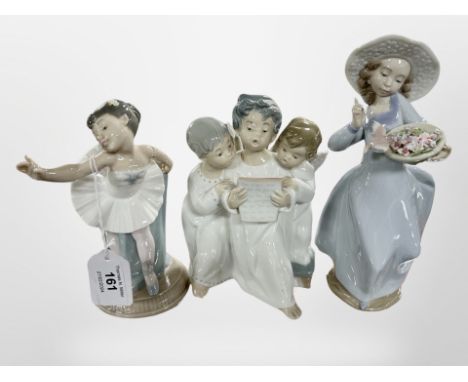 A Lladró figure group of three boys dressed as angels, further Lladró figure of a lady with a bird and a Nao figure of a ball