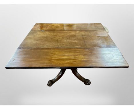 A George III mahogany drop leaf dining table on carved lion paw feet, 118 cm x 120 cm x 71 cm (extended)